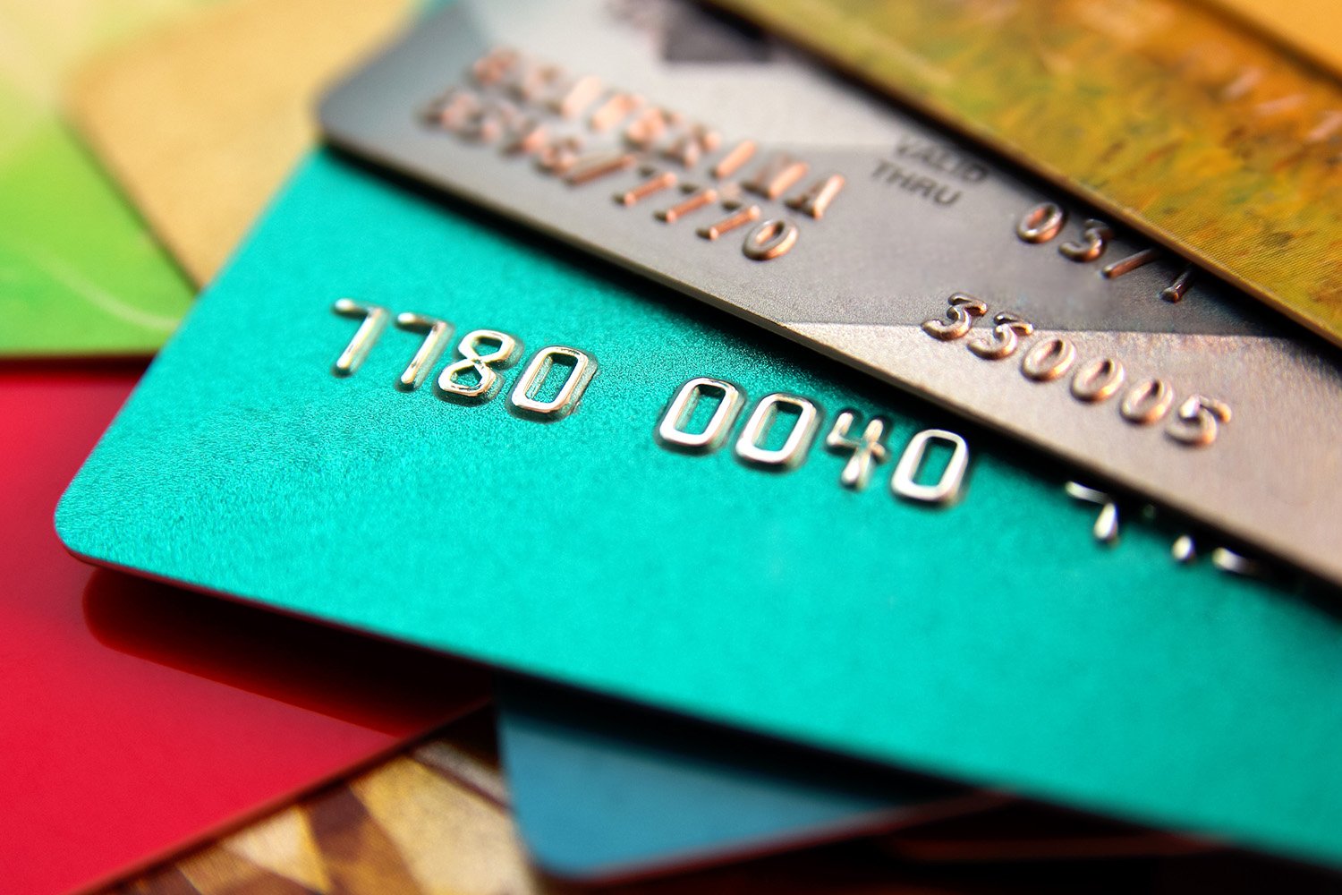 A pile of multicolor credit cards representing various financial options at a leading financial institution.