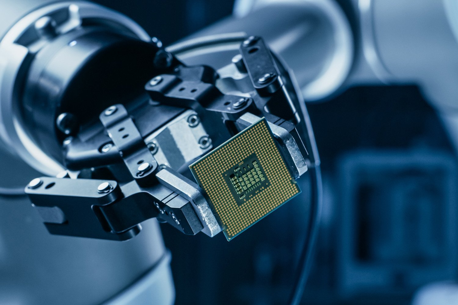 Robot Arm Holding a Microchip, Symbolizing Innovation in Semiconductors and Connectivity