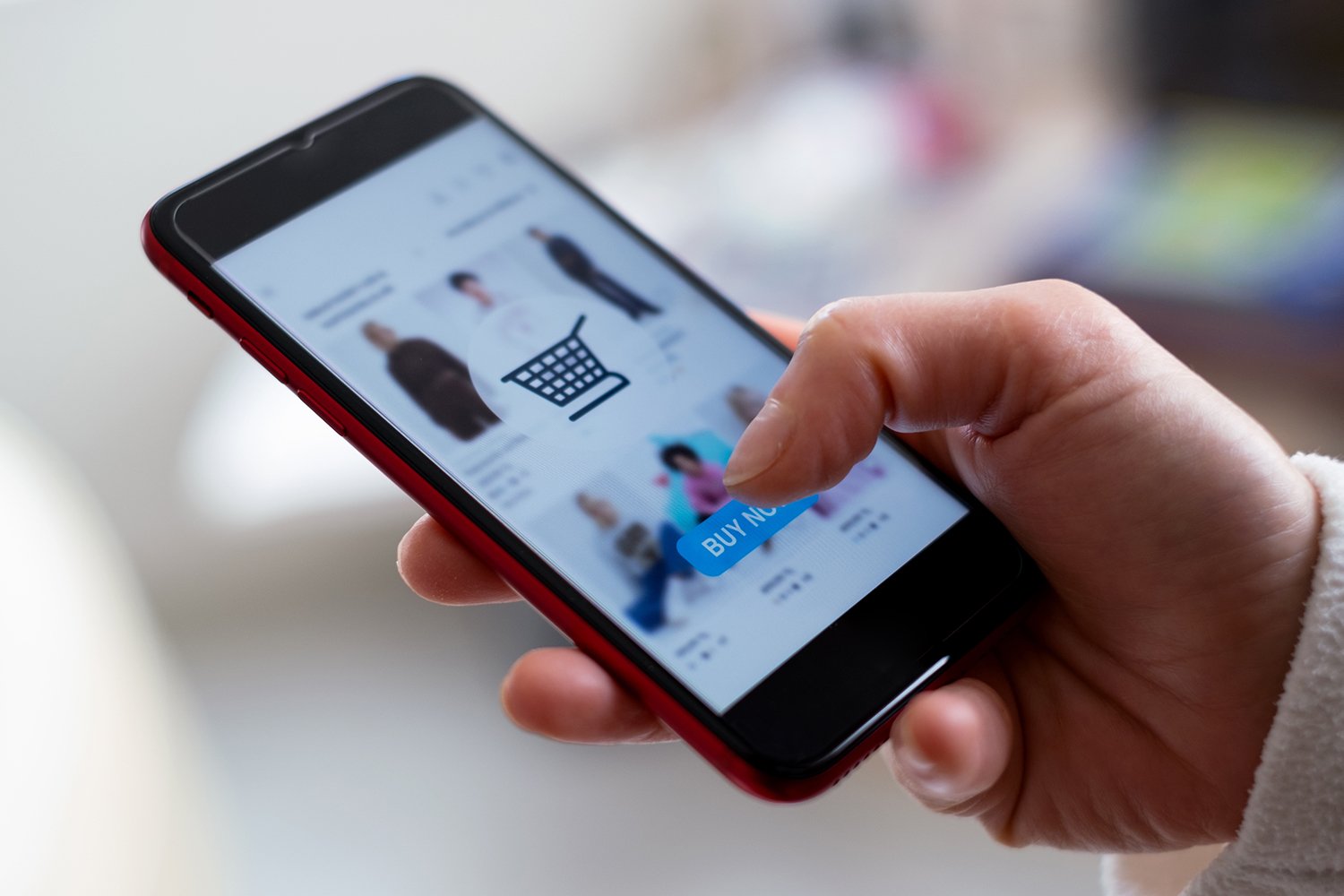 A person shopping online on a smart phone