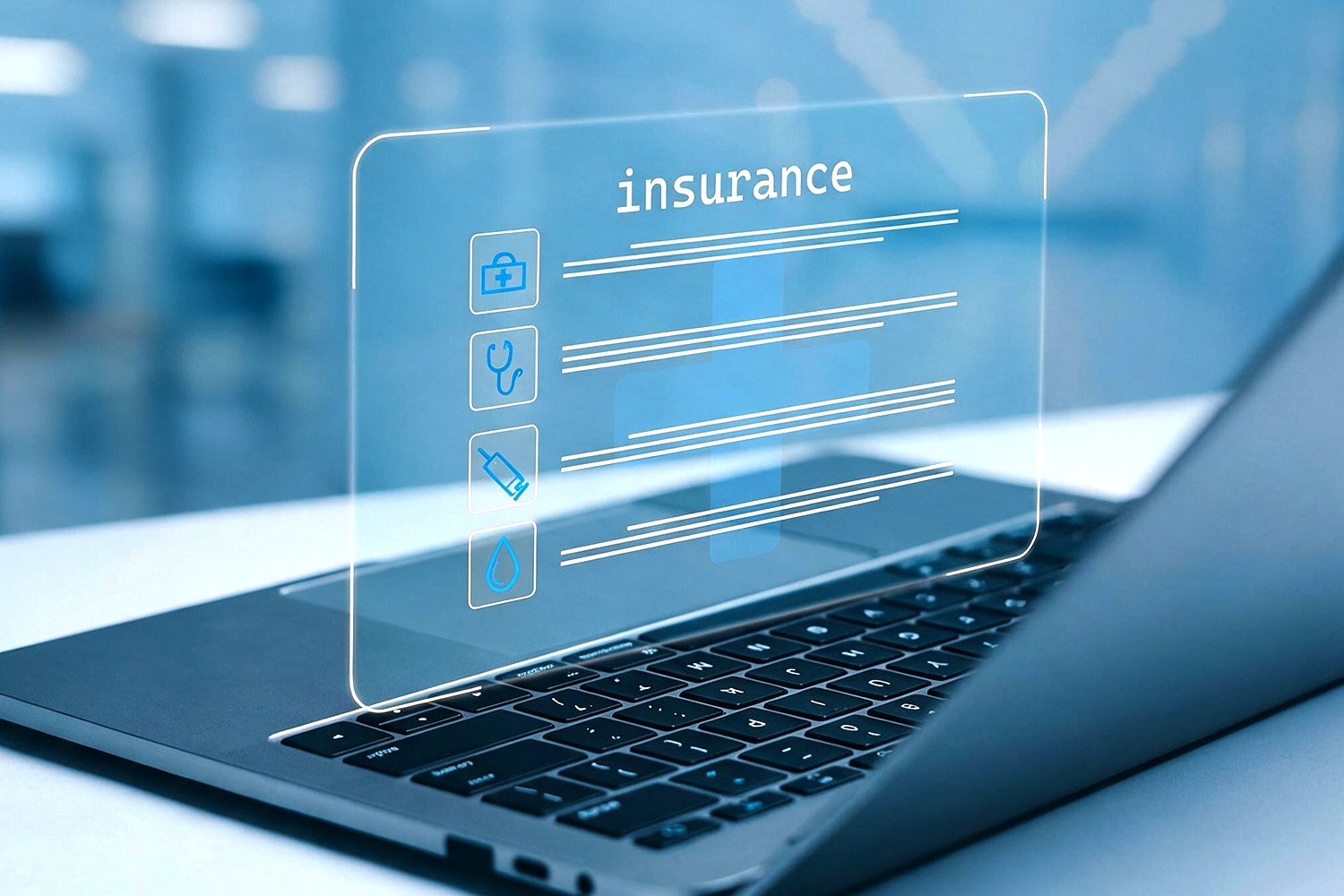 Looking at insurance data on a laptop