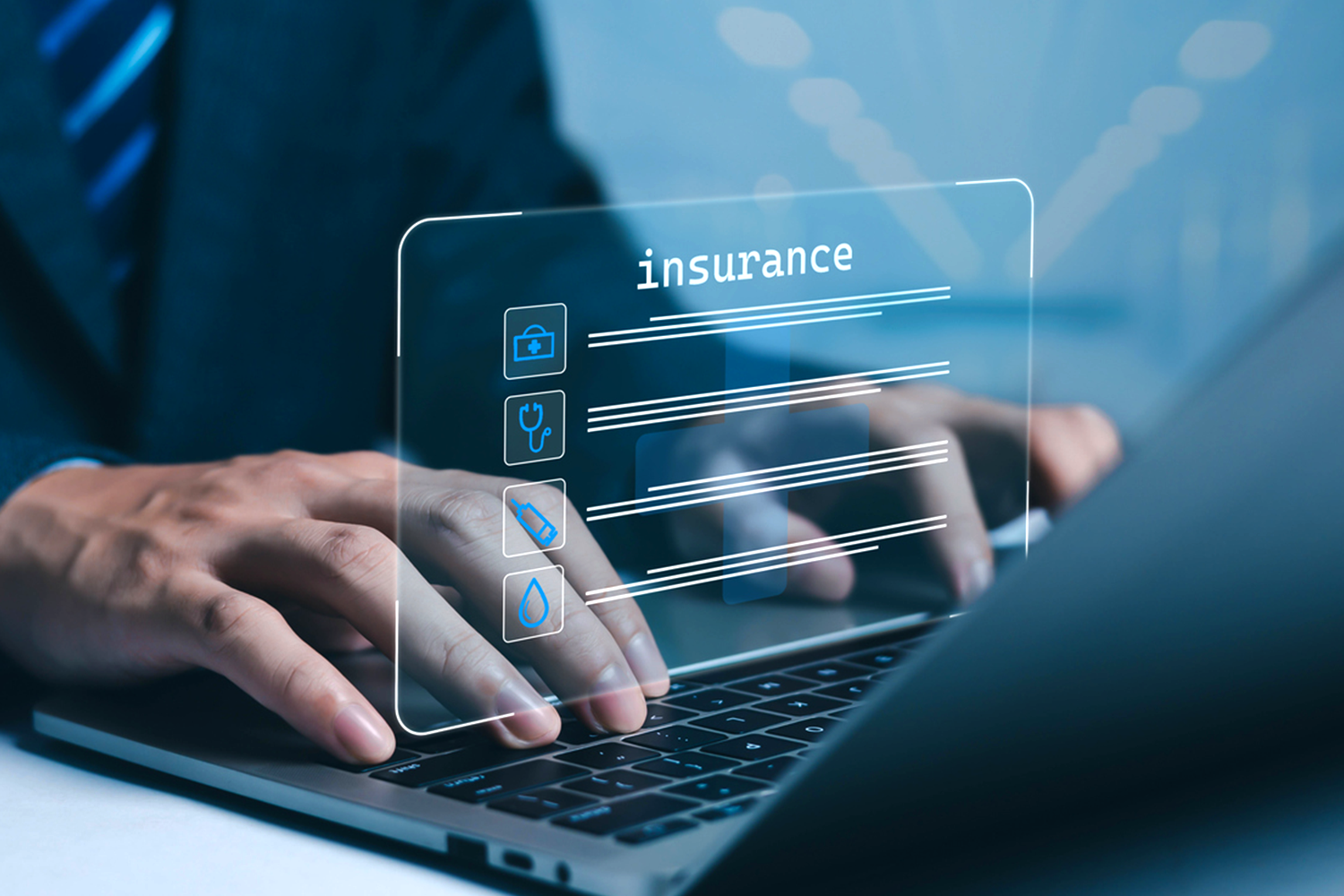 Looking at insurance data on a laptop