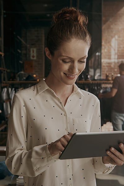 A store owner working on a tablet