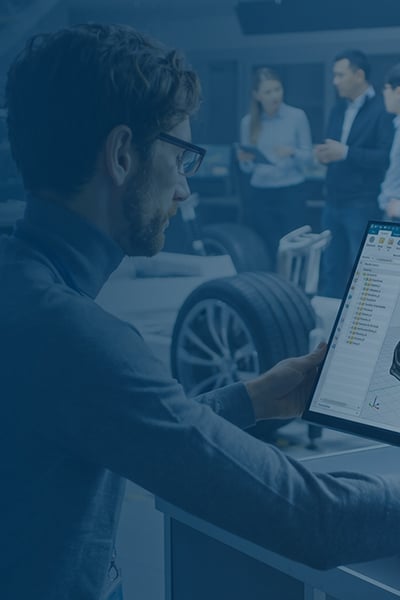 An engineer in a lab designing a car