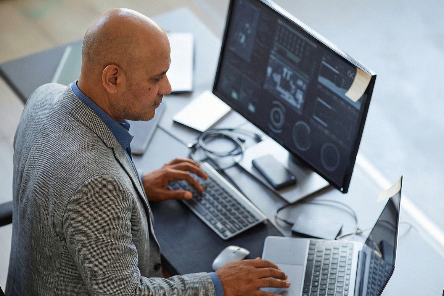 A Perficient consultant working on a laptop
