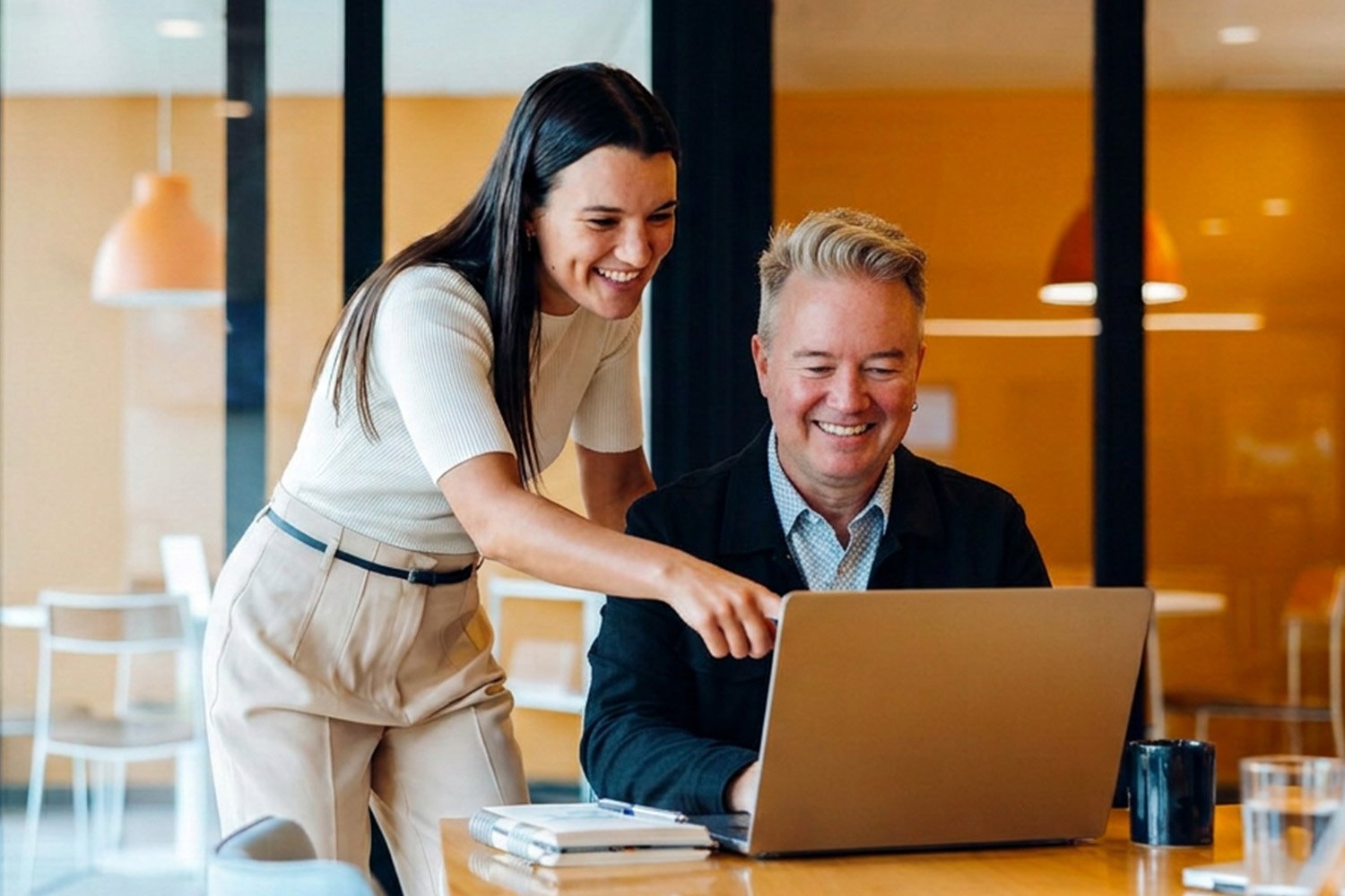 colleagues looking at a laptop