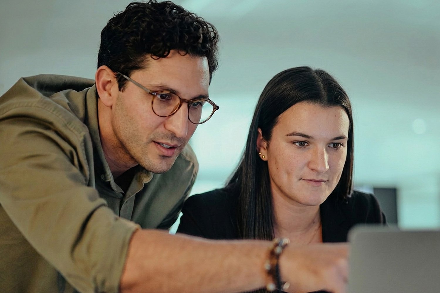 colleagues looking at a laptop
