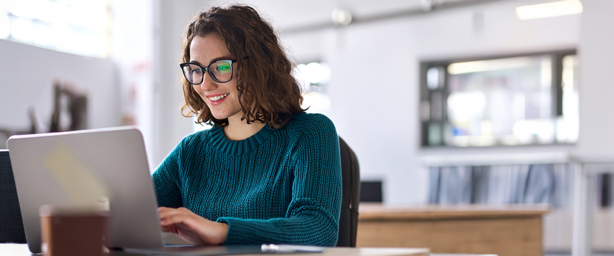 A woman working on a laptop