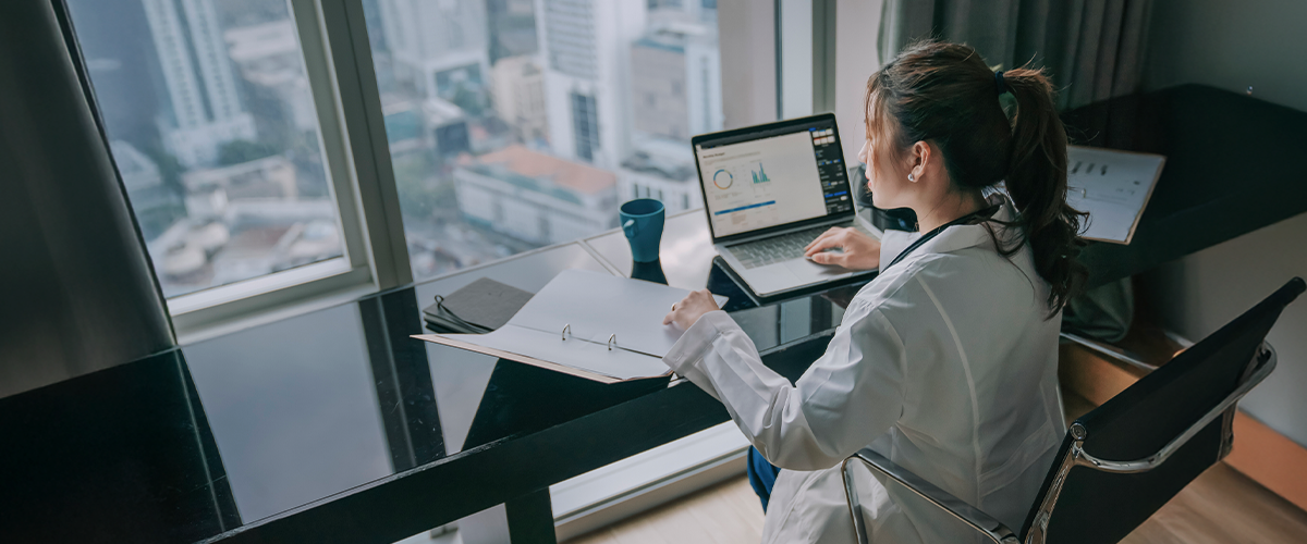 healthcare professional at computer