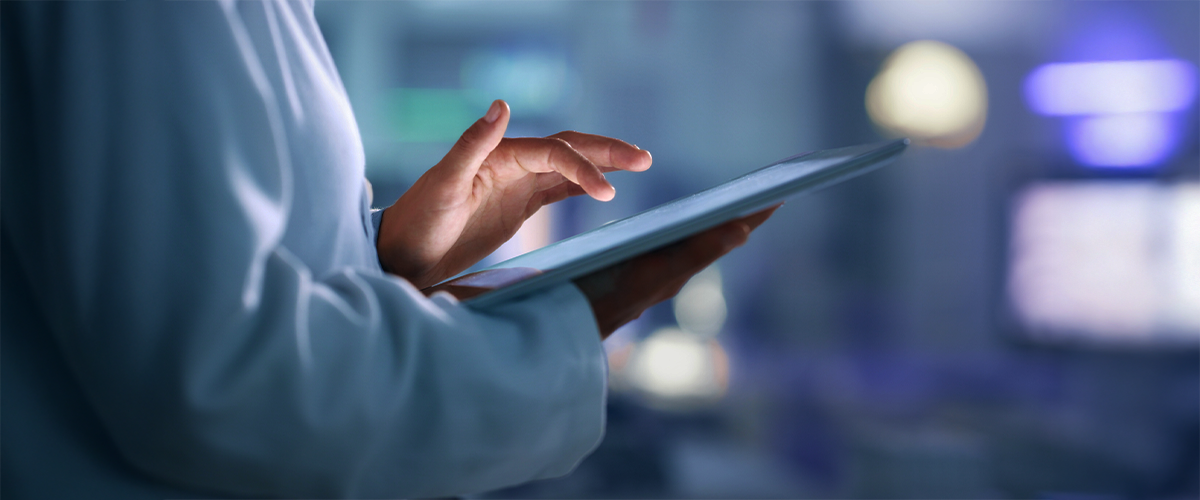 healthcare professional on tablet