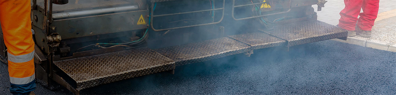 Truck pouring hot asphalt