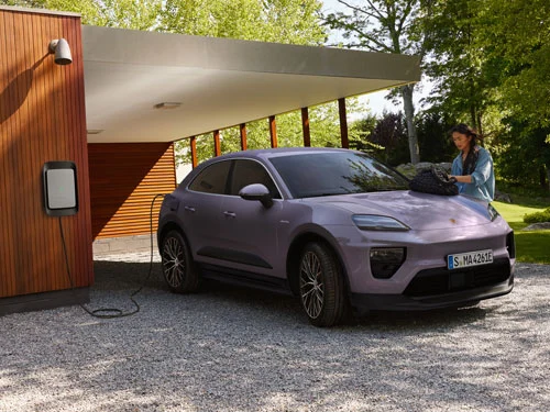 Lady charging her Provence coloured Porsche Macan electric at home