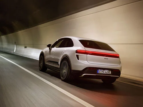 White Macan Turbo driving through a tunnel