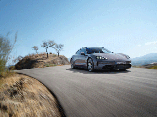 Taycan Sport Turismo driving on road