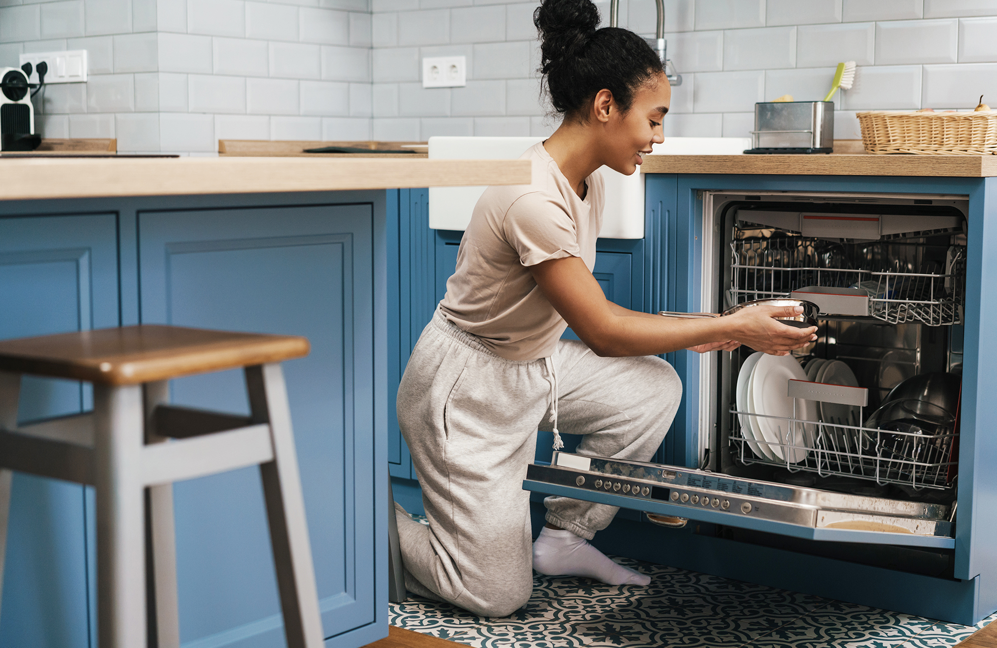 Woman loading dishes