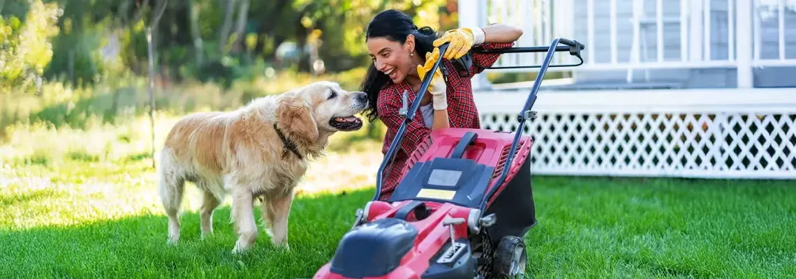 Woman_With_Dog_Push_lawn_mower