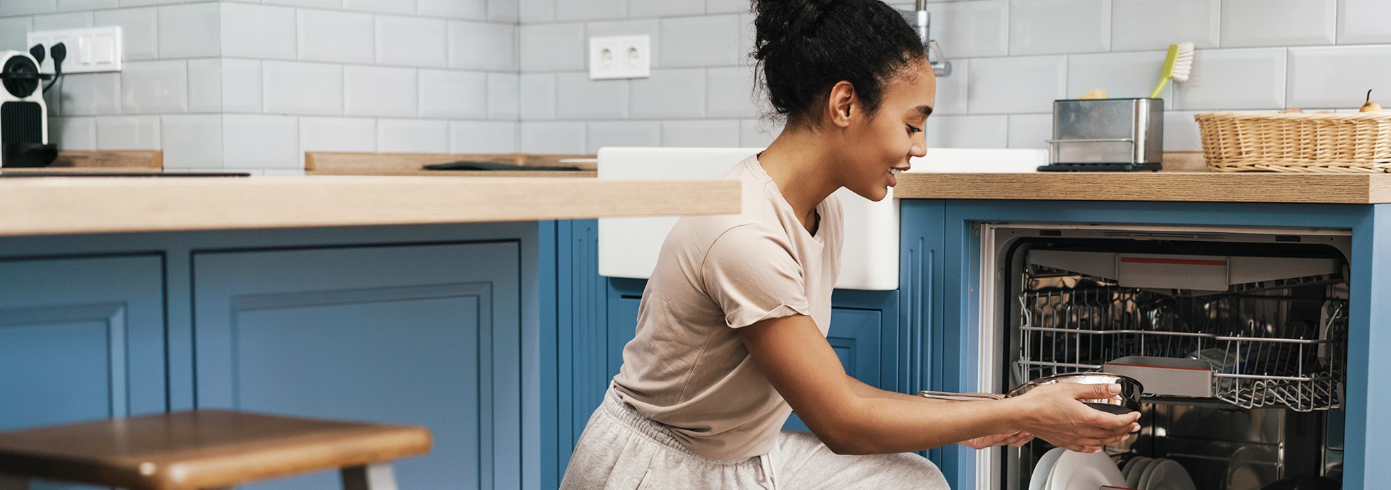 Woman loading dishes
