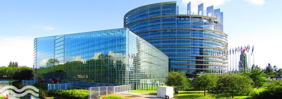 A view of the European Parliament building across the water