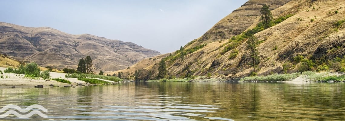 A calm river with banks either side, somewhere in the US