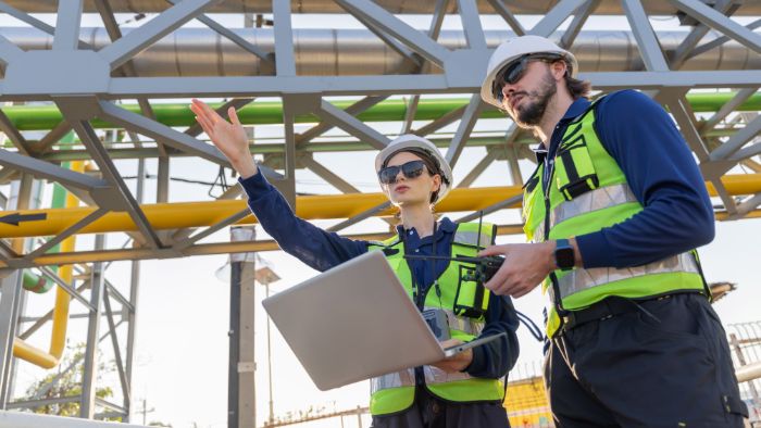 AQD-engineers-inspecting-industrial-plant-pipes-700x3940x