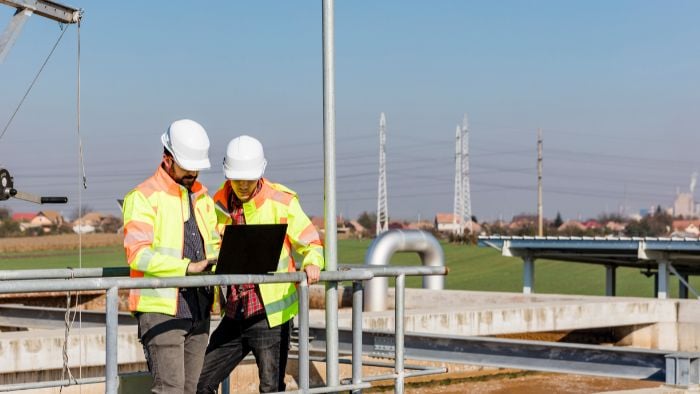 AQD-engineers-working-on-water-treatment-plant-with-laptop-700x394px