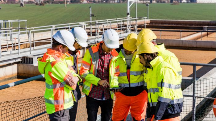 AQD-engineers-and-workers-assessing-wastewater-700x394px