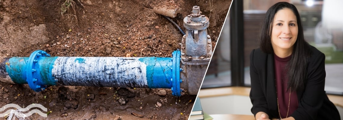 Water pvc pipe exposed in muddy ditch