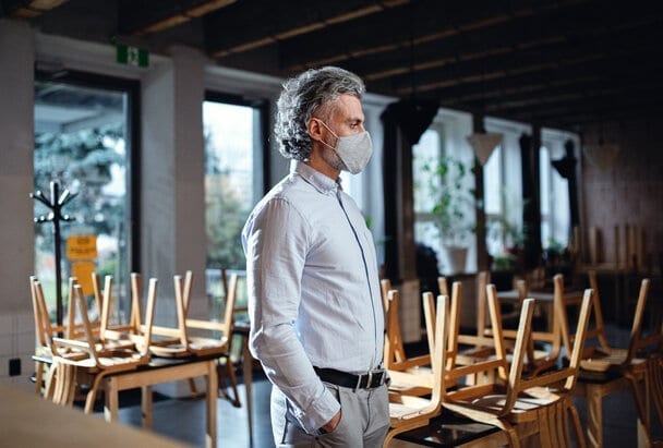 frustrated-owner-standing-in-closed-cafe