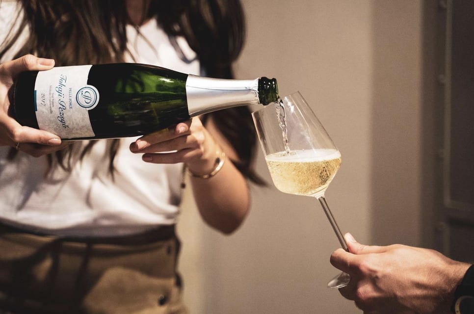 woman pouring wine