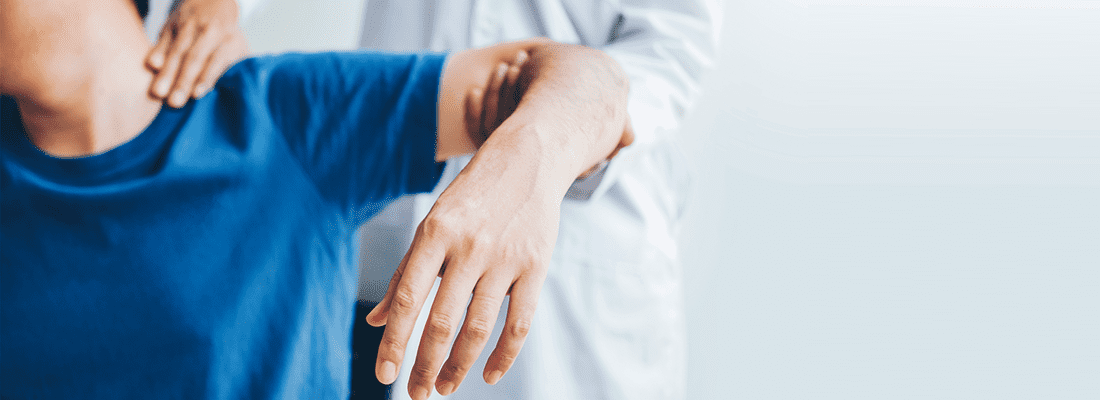 What is ergonomics and how does it reduce absenteeism?