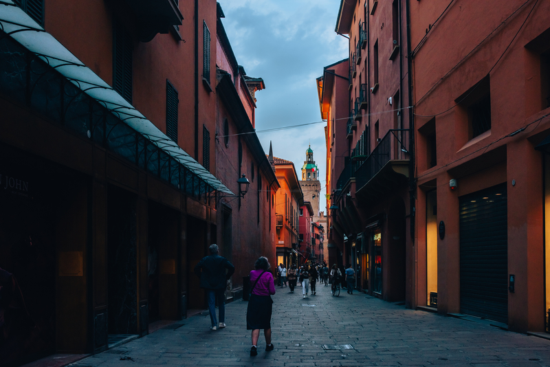 Bologna street with people walking and cycling