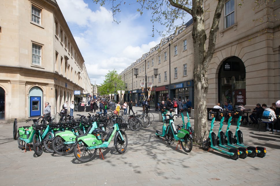Shared bikes and scooters parked in Bath city centre