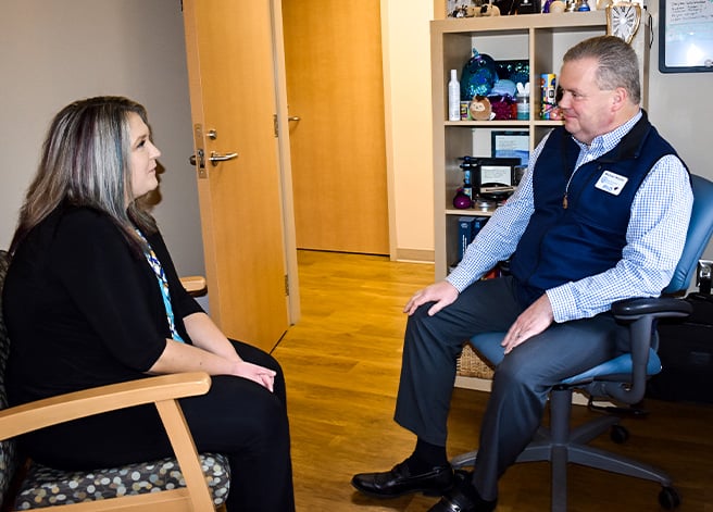 Reid Health Pediatric Neuropsychologist Michael Woodin, Ph.D., interacting with a patient
