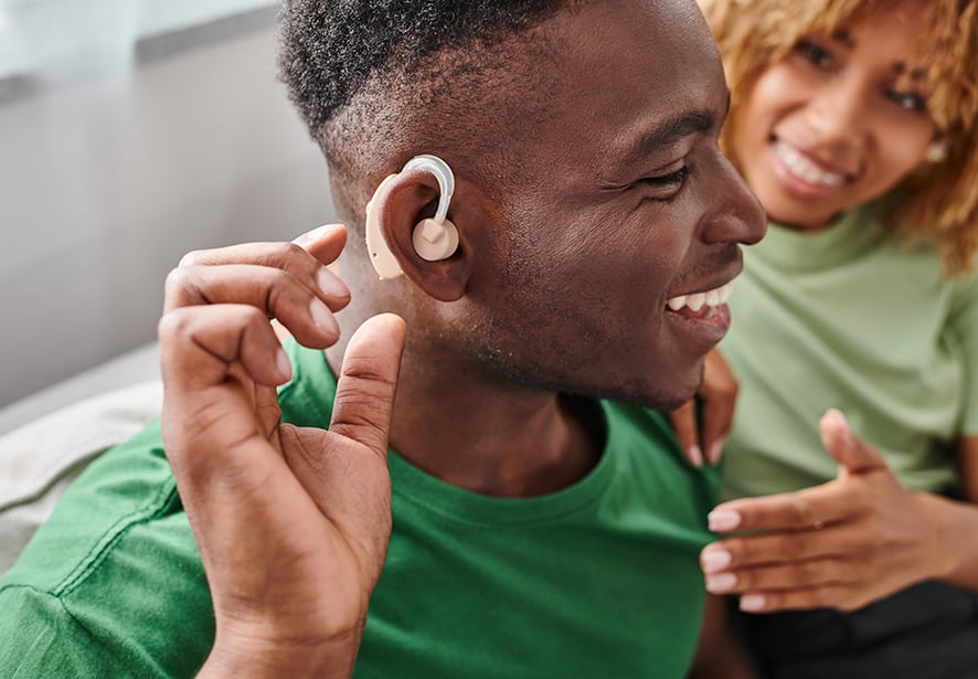 african american man in hearing aid device
