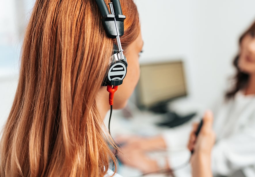 woman getting an auditory test at a hearing clinic
