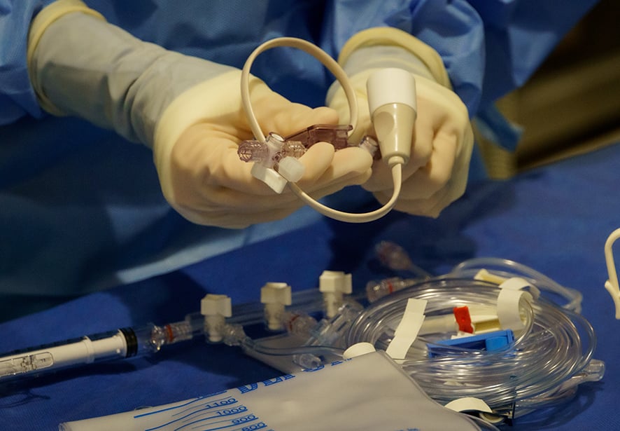A member of the cath lab team preparing for a procedure