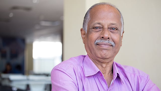 An older gentleman smiling