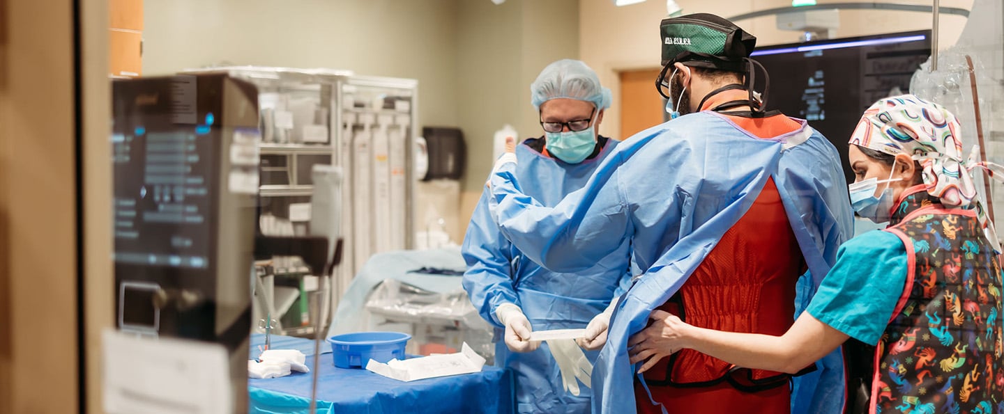 Reid Health Cardiologist Dr. Ahmed Amro and his team preparing for surgery 