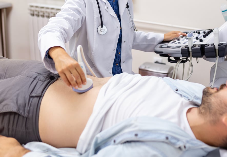 A man having an ultrasound completed for a vascular scan