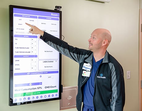 Reid Health Nurse Vince Kenndey demonstrating how to use a smart board