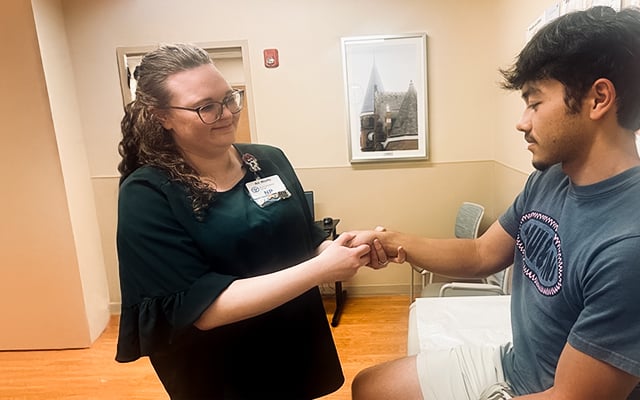 Reid Health's Ali Wolfe-Moon examining a patient