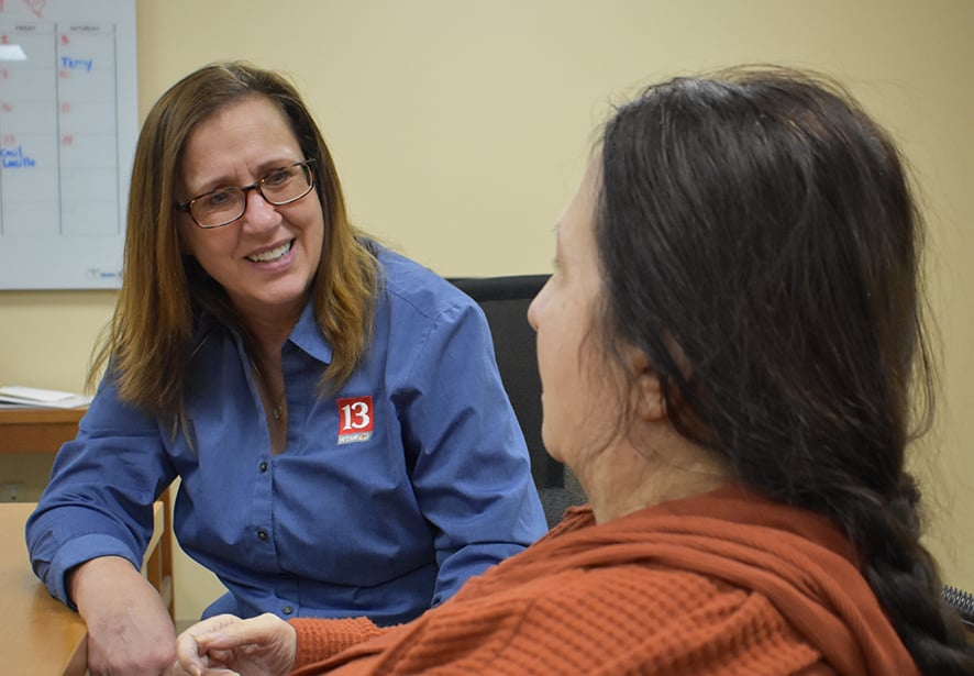 A family member of a PACE participant smiling at her family member