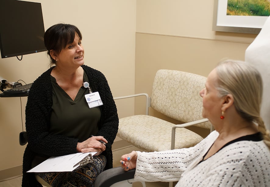 Reid Health's PACE social worker, Jevon consulting with a patient