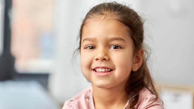 happy smiling little girl at home