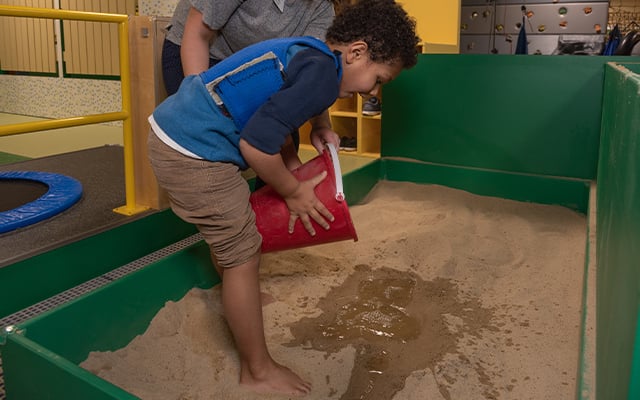 A child participating in therapy session at Reid Pediatric Rehabilitation Services