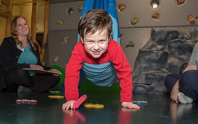 A child participating in therapy session at Reid Pediatric Rehabilitation Services