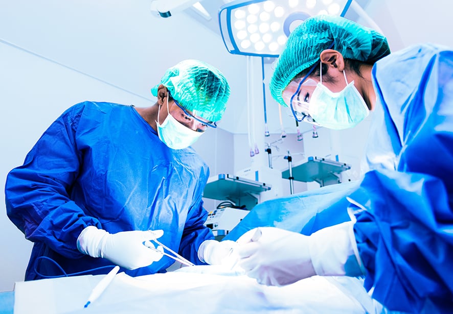 A surgical team working together to complete surgery 