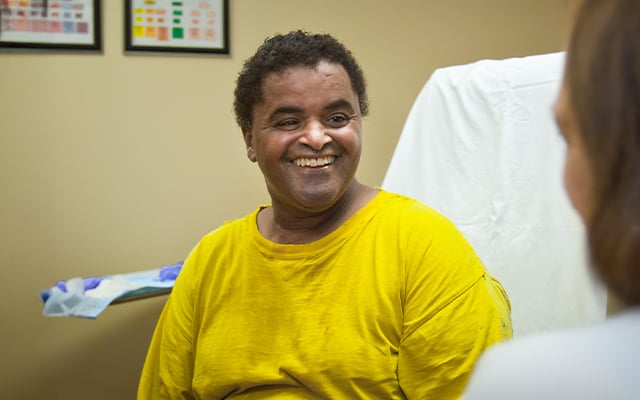 A Reid Health Wound Care patient smiling at a care provider