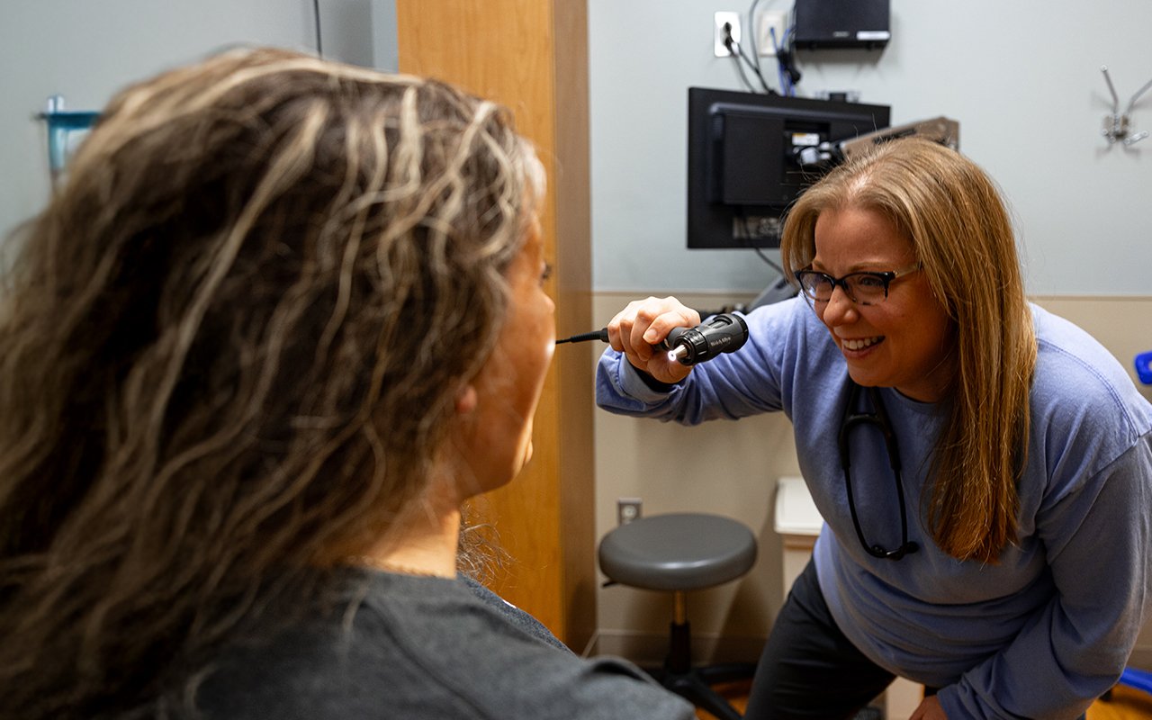 Reid Health's Erin Harris NP, examining a patient at Reid Ready Care Clinic