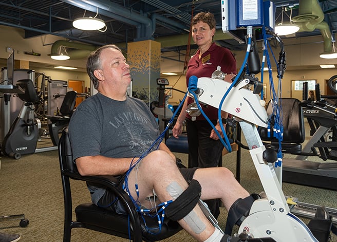 A patient working with a care provider at the Outpatient Rehabilitation office. 