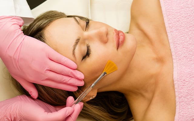 A women receiving a chemical peel at a spa. 